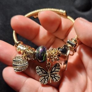 GOLD STAINLESS STEEL TWIST CHARM BRACELET